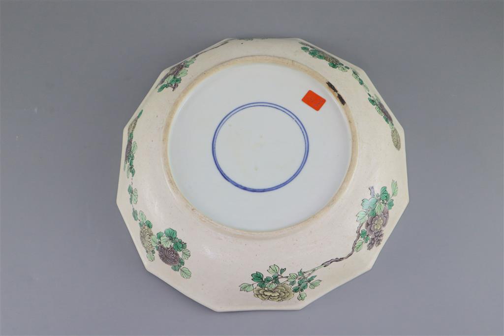 An unusual Chinese famille verte decorated biscuit porcelain twelve sided dish, 19th century in Kangxi style, 26cm wide